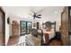 Bright bedroom with a wooden bed frame and access to a patio at 35035 N Whileaway Rd, Carefree, AZ 85377