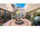 Charming courtyard with fountain and spiral staircase at 35035 N Whileaway Rd, Carefree, AZ 85377