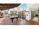 Game room with pool table and patio access at 35035 N Whileaway Rd, Carefree, AZ 85377