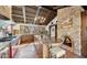 Spacious kitchen features a stone fireplace, custom cabinetry, and high-end appliances at 35035 N Whileaway Rd, Carefree, AZ 85377