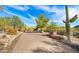Landscaped walkway with desert plants and a brick pathway at 35035 N Whileaway Rd, Carefree, AZ 85377