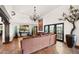 Spacious living room with tile floors and a large comfortable sofa at 35035 N Whileaway Rd, Carefree, AZ 85377