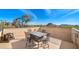 Rooftop patio with table, chairs, and fire pit; scenic views at 35035 N Whileaway Rd, Carefree, AZ 85377