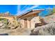 Stone shed near the pool area, surrounded by desert landscaping at 35035 N Whileaway Rd, Carefree, AZ 85377