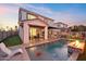 Home with a refreshing pool, fire pit, putting green and artistic wall at 3750 E Earll Dr, Phoenix, AZ 85018