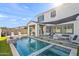 Stunning backyard oasis with a sparkling pool, spacious patio, and fire pit at 3750 E Earll Dr, Phoenix, AZ 85018
