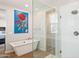 Modern bathroom with soaking tub and glass shower at 3750 E Earll Dr, Phoenix, AZ 85018