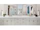 Clean bathroom with double vanity and large mirror at 3750 E Earll Dr, Phoenix, AZ 85018