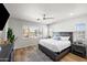 Spacious bedroom with wood floors and large window at 3750 E Earll Dr, Phoenix, AZ 85018