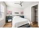 Charming bedroom with a comfortable bed, light wood floors, and built in shelving at 3750 E Earll Dr, Phoenix, AZ 85018