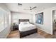 Bright bedroom featuring wood floors and modern decor at 3750 E Earll Dr, Phoenix, AZ 85018