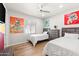 Twin bedroom with two beds, a dresser, and vibrant wall art at 3750 E Earll Dr, Phoenix, AZ 85018