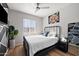 Comfortable bedroom with a metal bed frame, large window, and modern decor at 3750 E Earll Dr, Phoenix, AZ 85018