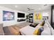 Spacious living room featuring a sectional sofa, large TV, and stylish decor at 3750 E Earll Dr, Phoenix, AZ 85018