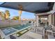 Tranquil backyard with a spacious pool and seating area at 3750 E Earll Dr, Phoenix, AZ 85018
