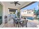 Relaxing patio area with pool, table and chairs at 3750 E Earll Dr, Phoenix, AZ 85018