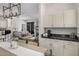 Modern kitchen with white cabinets and granite counters at 7887 N 16Th St # 224, Phoenix, AZ 85020
