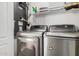 Laundry room with washer, dryer, and shelving at 7887 N 16Th St # 224, Phoenix, AZ 85020