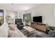 Spacious living room with fireplace and large TV at 7887 N 16Th St # 224, Phoenix, AZ 85020