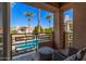 Private patio overlooking the community pool and palm trees at 7887 N 16Th St # 224, Phoenix, AZ 85020