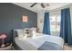 Spacious bedroom with gray walls and a ceiling fan at 8502 E Catalina Dr, Scottsdale, AZ 85251