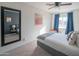 Cozy bedroom featuring a gray bed frame and a large mirror at 8502 E Catalina Dr, Scottsdale, AZ 85251