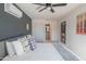 Main bedroom with a gray bed frame and access to the bathroom at 8502 E Catalina Dr, Scottsdale, AZ 85251