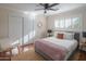 Bedroom with a gray bed frame and a woven chair at 8502 E Catalina Dr, Scottsdale, AZ 85251