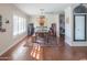 Sunlit dining room featuring a rustic table and arcade games at 8502 E Catalina Dr, Scottsdale, AZ 85251