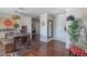 Bright dining room with wood floors and a rustic wooden table at 8502 E Catalina Dr, Scottsdale, AZ 85251