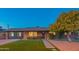 Brick ranch home with a landscaped front yard, and a large tree at 8502 E Catalina Dr, Scottsdale, AZ 85251