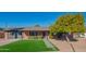 Updated mid-century modern home with a citrus tree in the front yard at 8502 E Catalina Dr, Scottsdale, AZ 85251