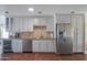 Bright kitchen boasts stainless steel appliances and ample cabinetry at 8502 E Catalina Dr, Scottsdale, AZ 85251