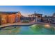 Inviting backyard oasis with a sparkling pool, patio, and outdoor kitchen at 8502 E Catalina Dr, Scottsdale, AZ 85251
