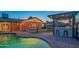 Relaxing backyard with a pool, covered patio, and built-in grilling station at 8502 E Catalina Dr, Scottsdale, AZ 85251