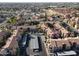 Overhead view of a condo community featuring well-maintained buildings, parking, and green spaces at 930 N Mesa Dr # 2073, Mesa, AZ 85201