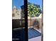 Relaxing balcony with patio furniture, umbrella, and rug at 930 N Mesa Dr # 2073, Mesa, AZ 85201