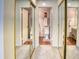 Hallway with mirrored closet doors that reflect the toilet in the Primary bathroom at 930 N Mesa Dr # 2073, Mesa, AZ 85201