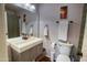 Modern bathroom featuring a gray vanity, wood floors, and a coordinated towel and decor set at 930 N Mesa Dr # 2073, Mesa, AZ 85201
