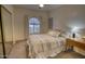 Comfortable bedroom featuring a neutral color palette, carpet floors, and a large window for natural light at 930 N Mesa Dr # 2073, Mesa, AZ 85201