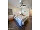 Well-lit bedroom with double bed and decorative wall hanging at 930 N Mesa Dr # 2073, Mesa, AZ 85201