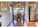 Cozy dining room featuring a dining table with dark wood, hardwood floors, and natural light at 930 N Mesa Dr # 2073, Mesa, AZ 85201