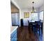 Bright dining area with four chairs and a chandelier at 930 N Mesa Dr # 2073, Mesa, AZ 85201