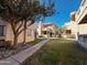 Building exterior with grassy courtyard and trees at 930 N Mesa Dr # 2073, Mesa, AZ 85201