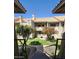 Back exterior view of condo building with stairs and landscaping at 930 N Mesa Dr # 2073, Mesa, AZ 85201