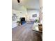 Living room with vaulted ceilings, comfortable seating, and a large TV at 930 N Mesa Dr # 2073, Mesa, AZ 85201