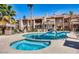 Community pool and spa with surrounding patio furniture at 930 N Mesa Dr # 2073, Mesa, AZ 85201