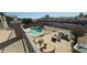 Enjoy outdoor living with a sparkling pool, built-in grill, and lounge area in the backyard at 11232 N 152Nd Ln, Surprise, AZ 85379