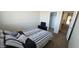 Relaxing bedroom showcasing carpet, a full bed, closet, and a doorway leading to the hallway at 11232 N 152Nd Ln, Surprise, AZ 85379