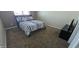 Comfortable bedroom with carpet flooring, a full bed, and neutral-toned walls at 11232 N 152Nd Ln, Surprise, AZ 85379